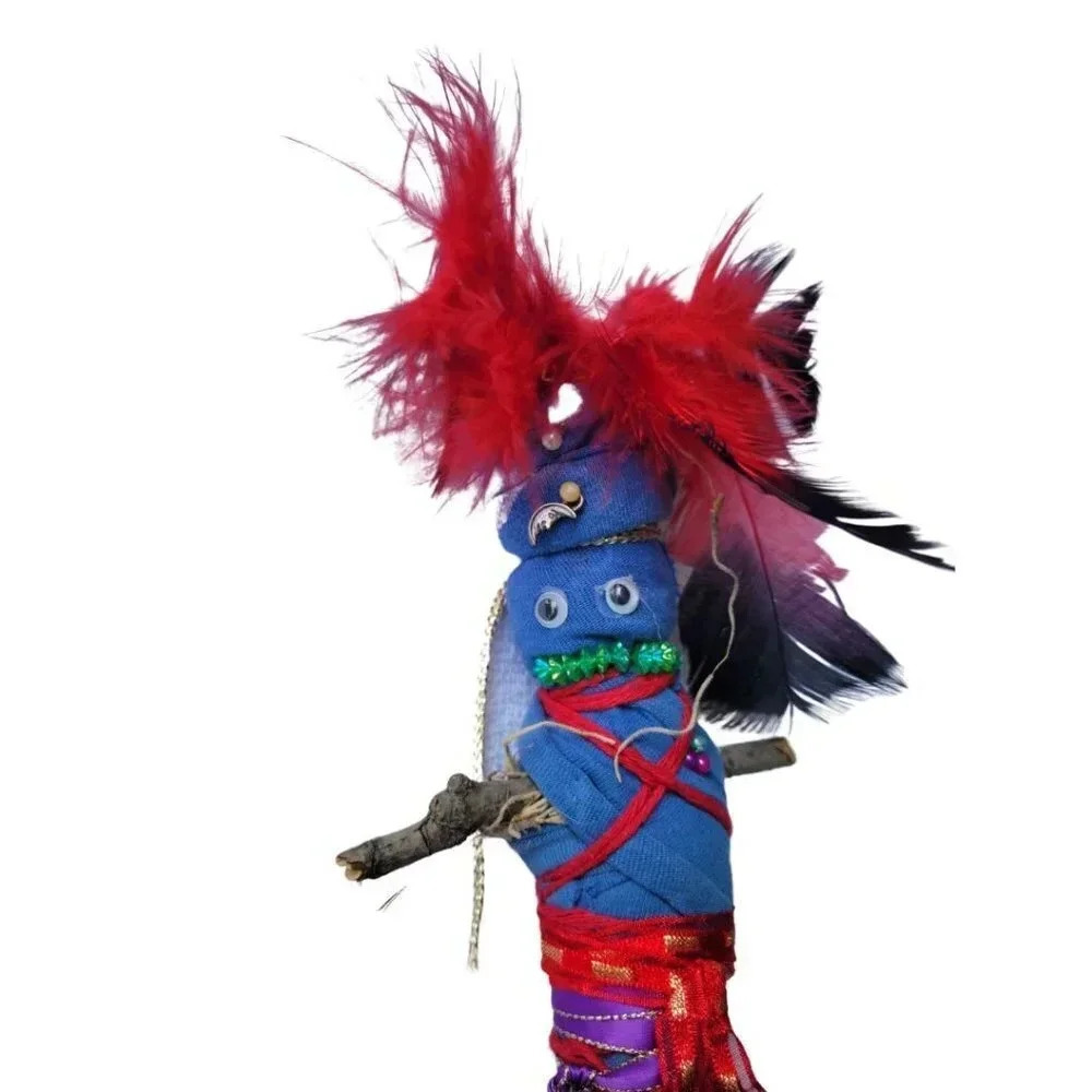 Homemade Doll with red feathers and googly eyes